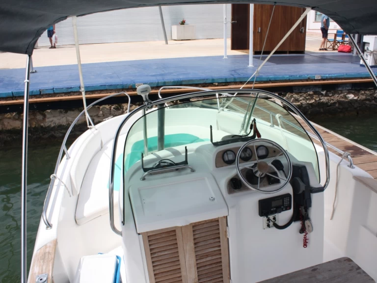 Jeanneau Cap Camarat 625 charter bareboat or captained in  Fornells
