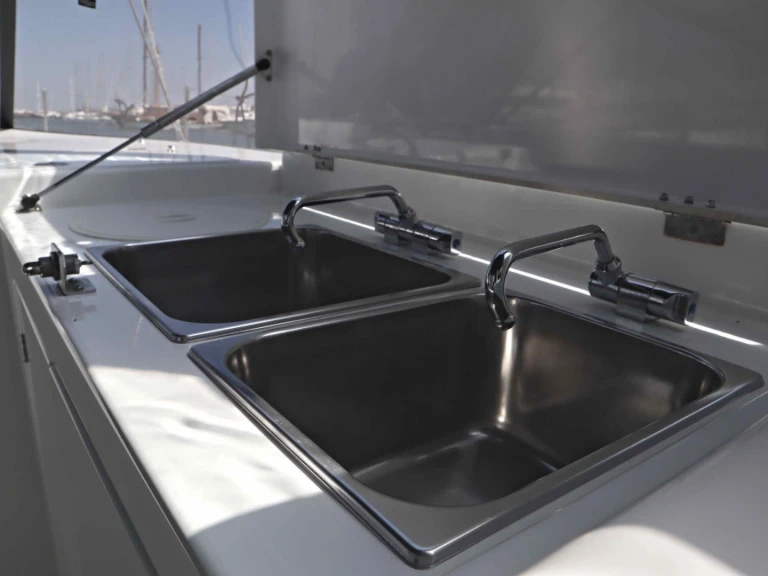 Jeanneau Sun Loft 47 (7 cab.) charter bareboat or captained in  Néa Péramos