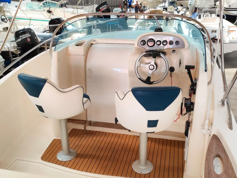 Rio Rio 750 Sol charter bareboat or captained in  Club Nàutic Ca'n Picafort