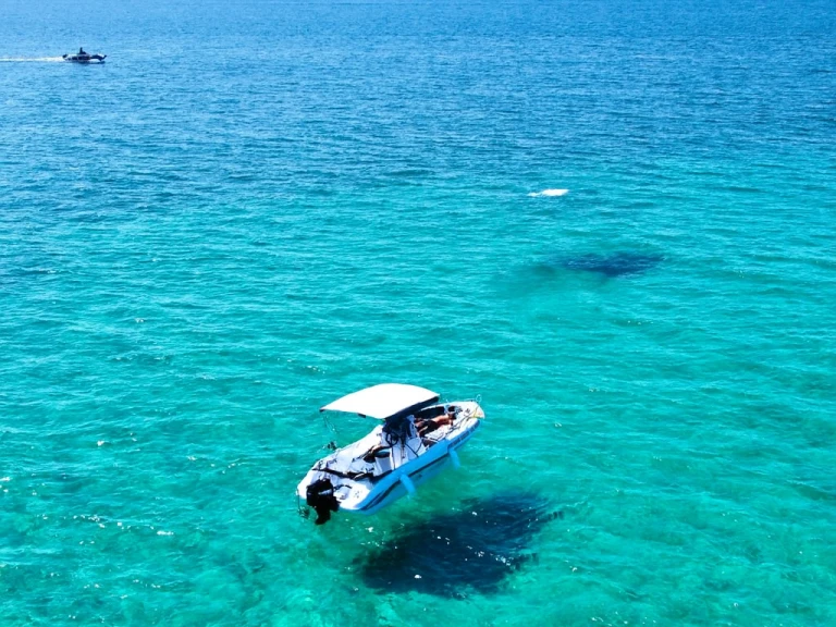 Albatros Open 5.65 charter bareboat or captained in  Porto Cesareo