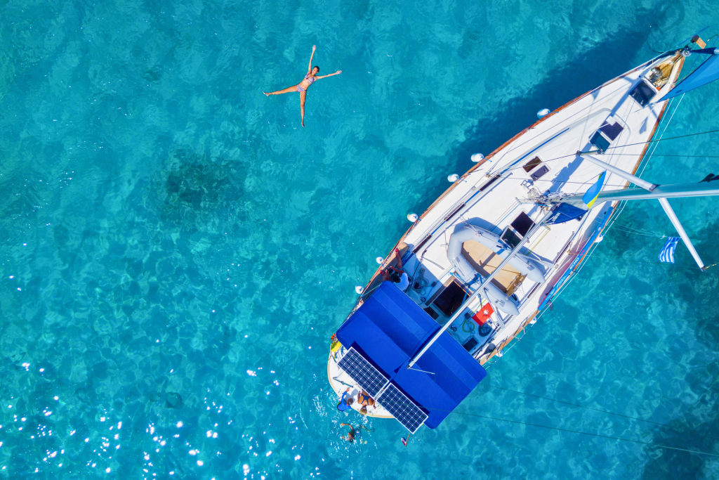 Sailboat seen from above in turquoise Mediterranean waters
